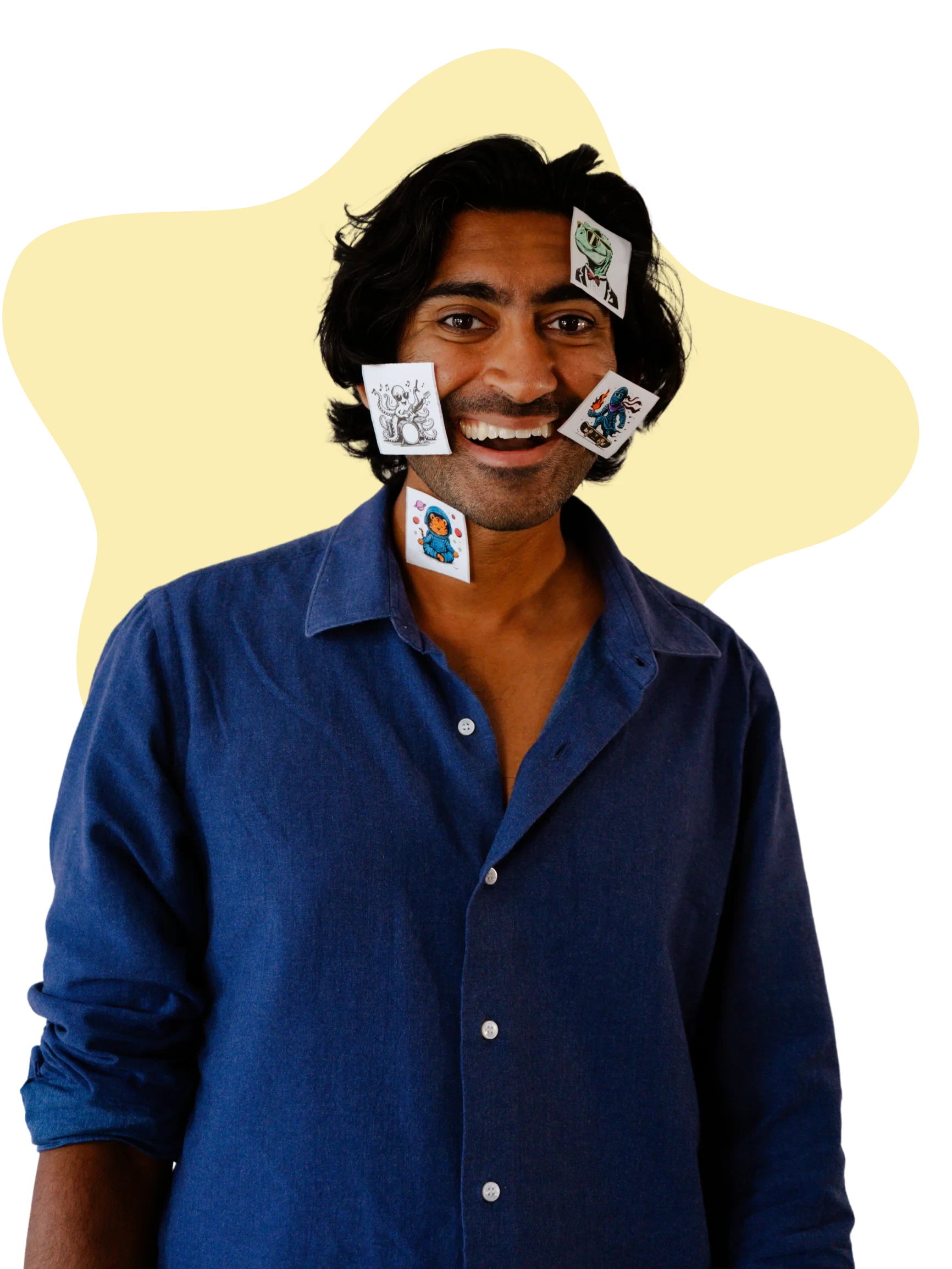 Arun Gupta, smiling, with small stickers stuck on his face and shirt